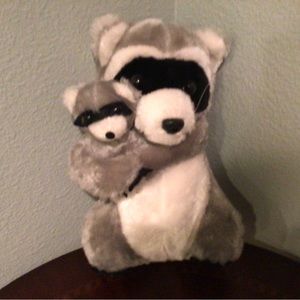 A mama raccoon with baby